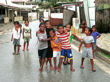 Kids after the rain, Ebeye, Kwajalein, RMI, © Sue Rosoff, all rights reserved